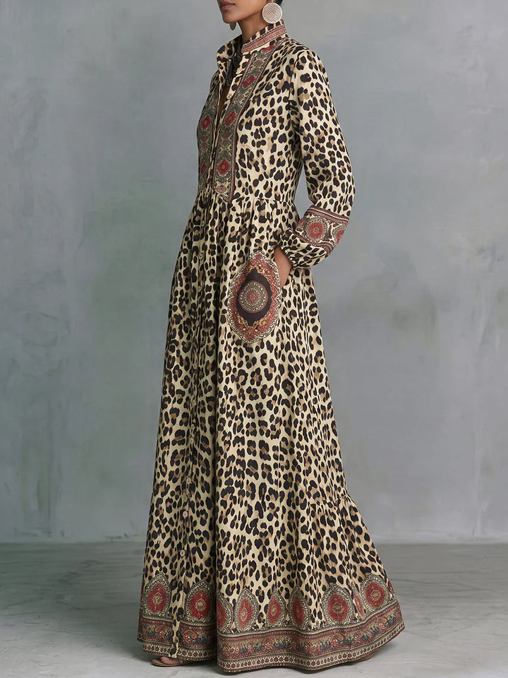 VESTIDO MAXI EM LINHA A ESTAMPADO LEOPARDO COM BOLSOS, MANGA ABALOADA E GOLA MAO