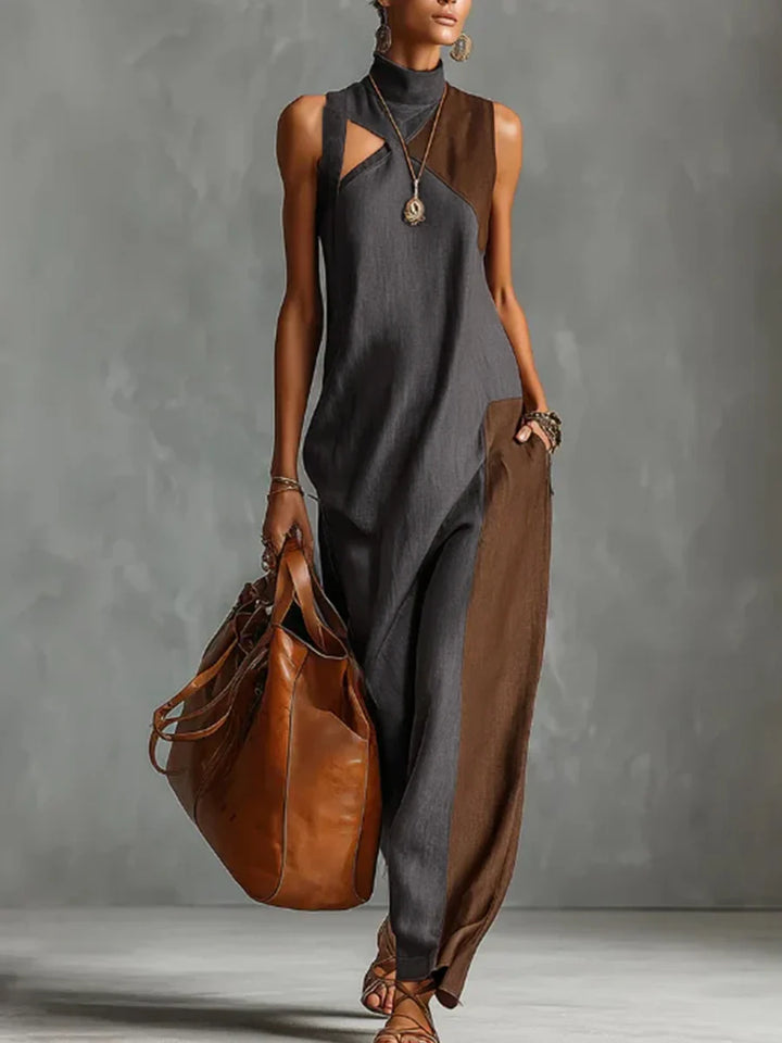 VESTIDO MAXI ASSIMÉTRICO SEM MANGAS FOLGADO COM BOLSOS, COR EM CONTRASTE E GOLA ALTA