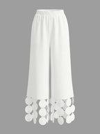 Pantalones pernera ancha con borlas color sólido