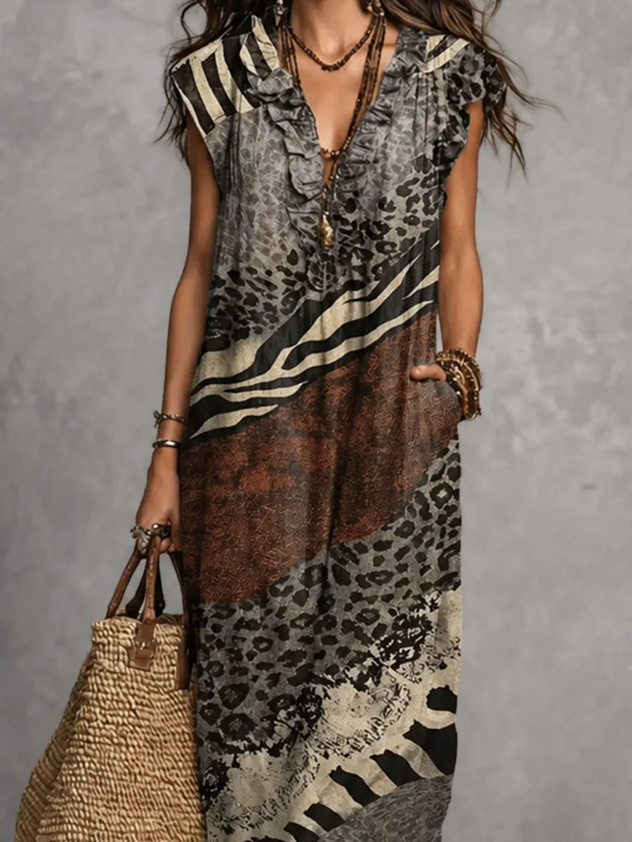 VESTIDO MAXI SOLTO SEM MANGAS COM BOLSOS, ESTAMPADO, FOLHOS E DECOTE EM V