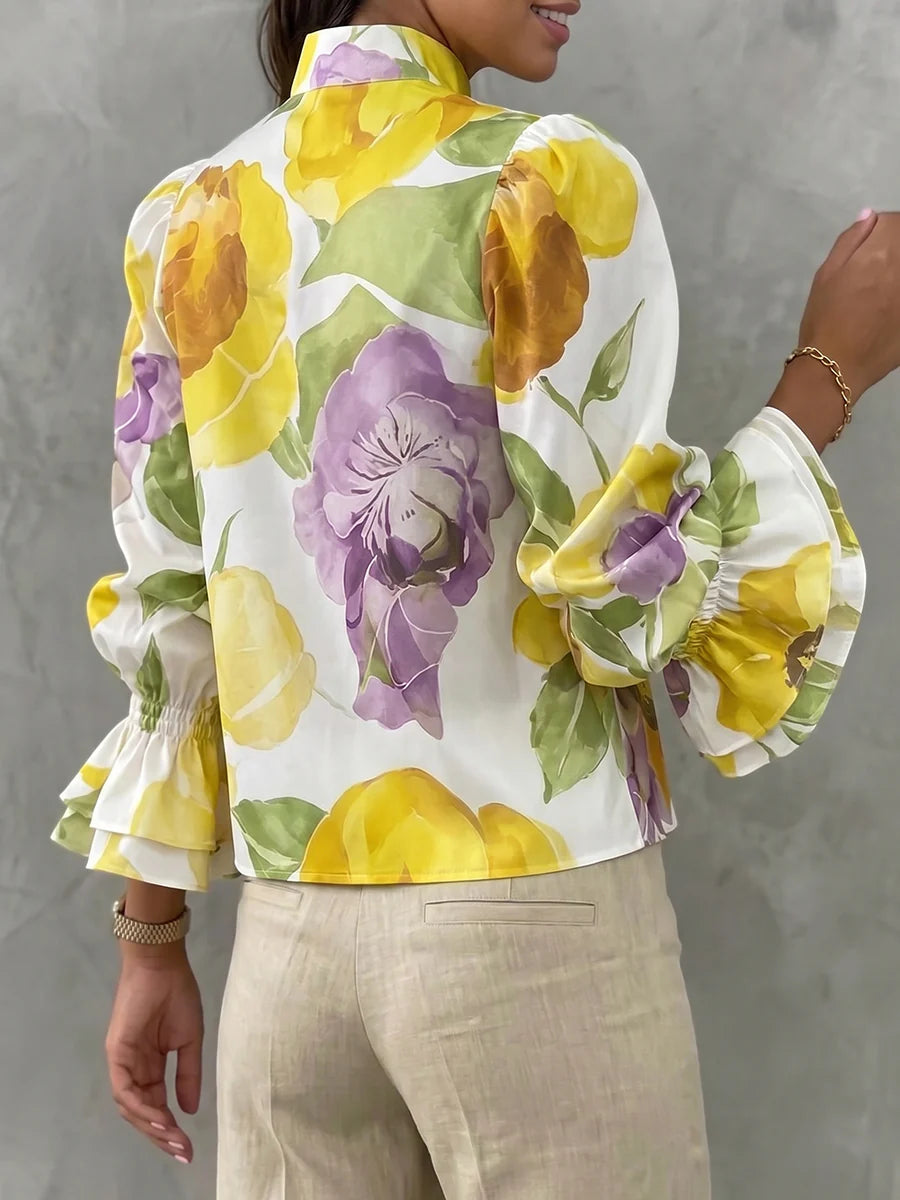 BLUSA SOLTA DE MANGA COMPRIDA EVASÊ COM ESTAMPADO FLORAL E DECOTE EM V
