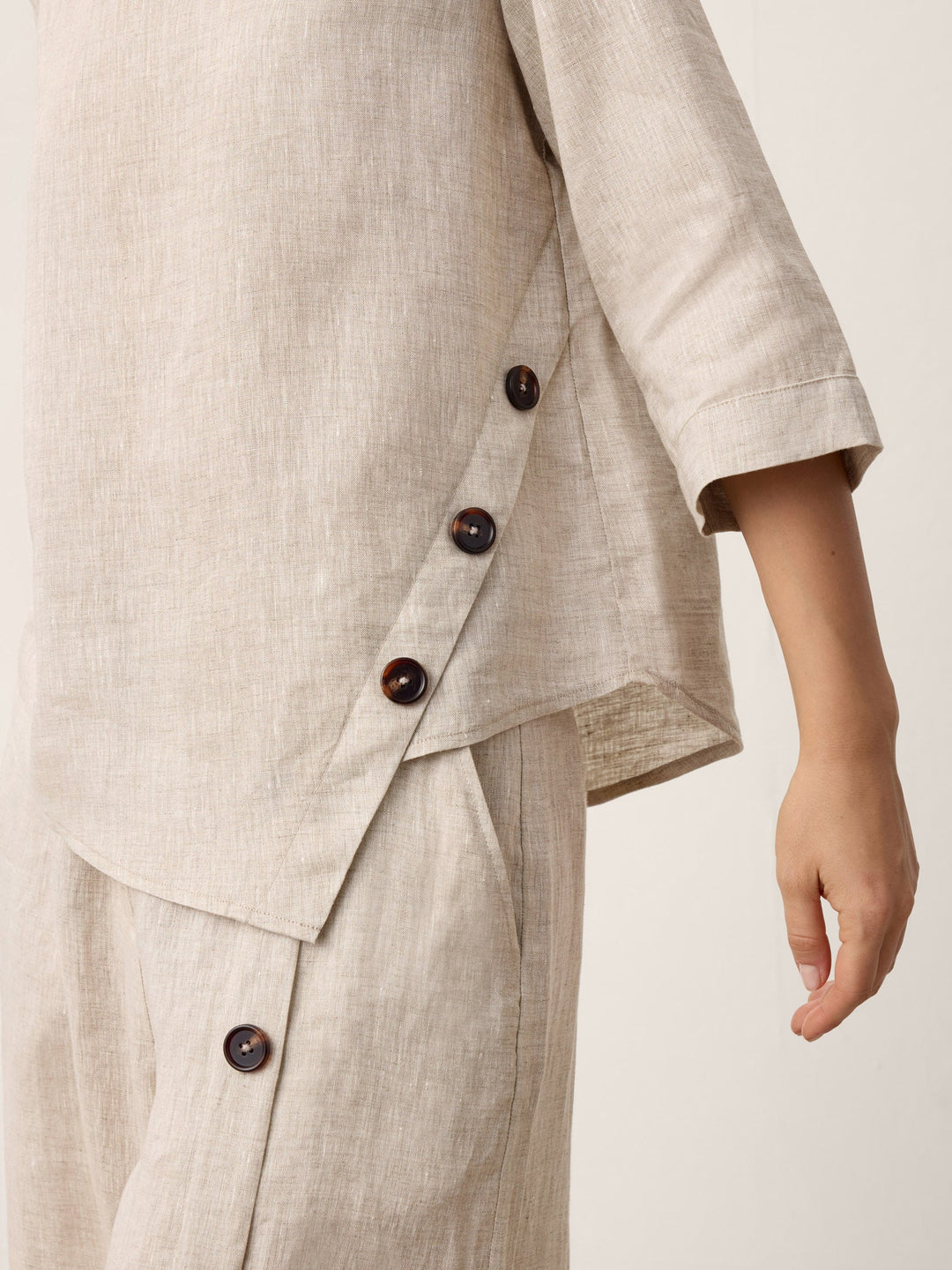 Nyla | Linen Top With Asymmetrical Hem And Decorative Buttons