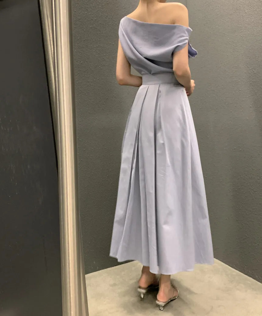 Conjunto dos piezas top cuello asimétrico y falda midi plisada k26050507