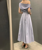 Conjunto dos piezas top cuello asimétrico y falda midi plisada k26050507