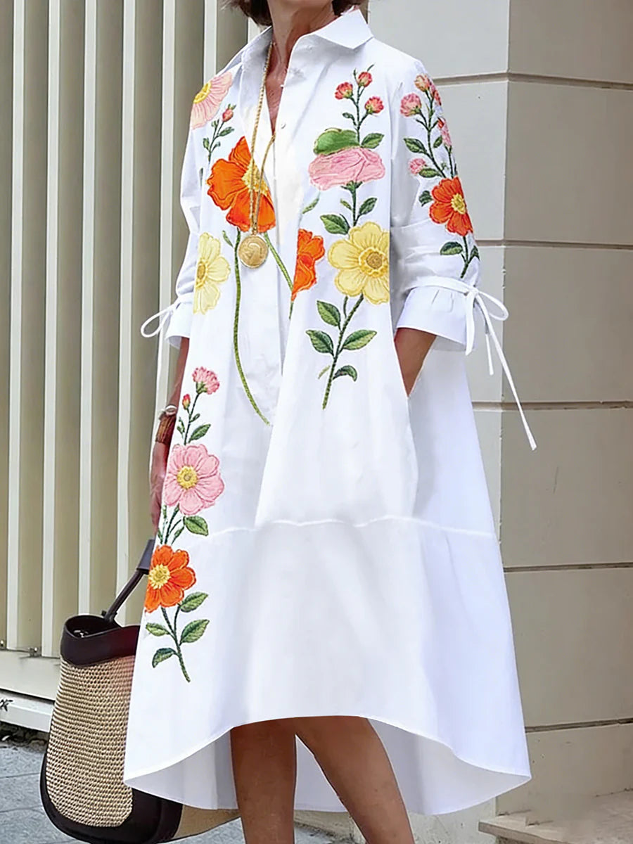 VESTIDO MIDI DE CAMISEIRO CORTE EM A DE MANGA MÉDIA COM BOTÕES, ESTAMPADO FLORAL, BOLSOS E LAÇO