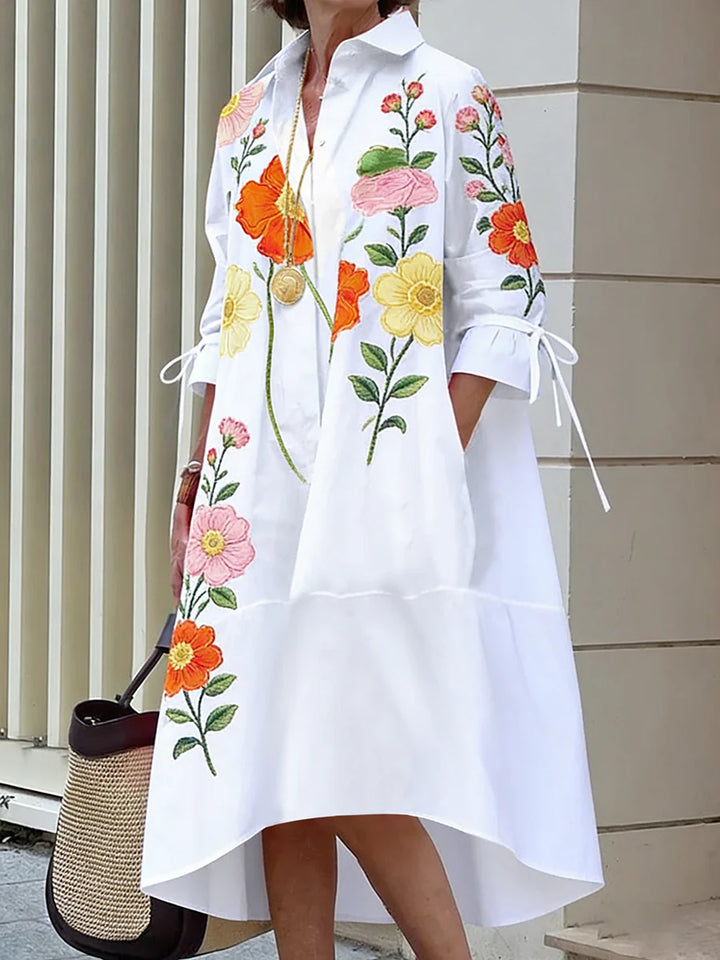 VESTIDO MIDI DE CAMISEIRO CORTE EM A DE MANGA MÉDIA COM BOTÕES, ESTAMPADO FLORAL, BOLSOS E LAÇO