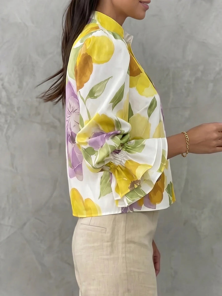BLUSA SOLTA DE MANGA COMPRIDA EVASÊ COM ESTAMPADO FLORAL E DECOTE EM V