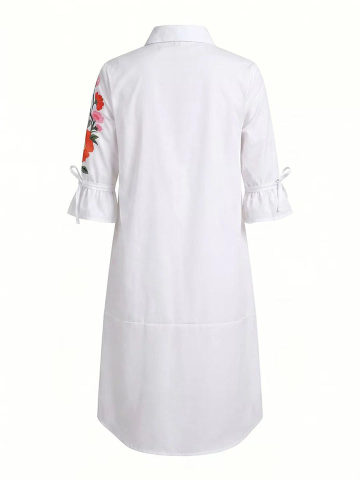 VESTIDO MIDI DE CAMISEIRO CORTE EM A DE MANGA MÉDIA COM BOTÕES, ESTAMPADO FLORAL, BOLSOS E LAÇO