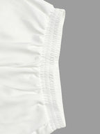 Pantalones pernera ancha con borlas color sólido