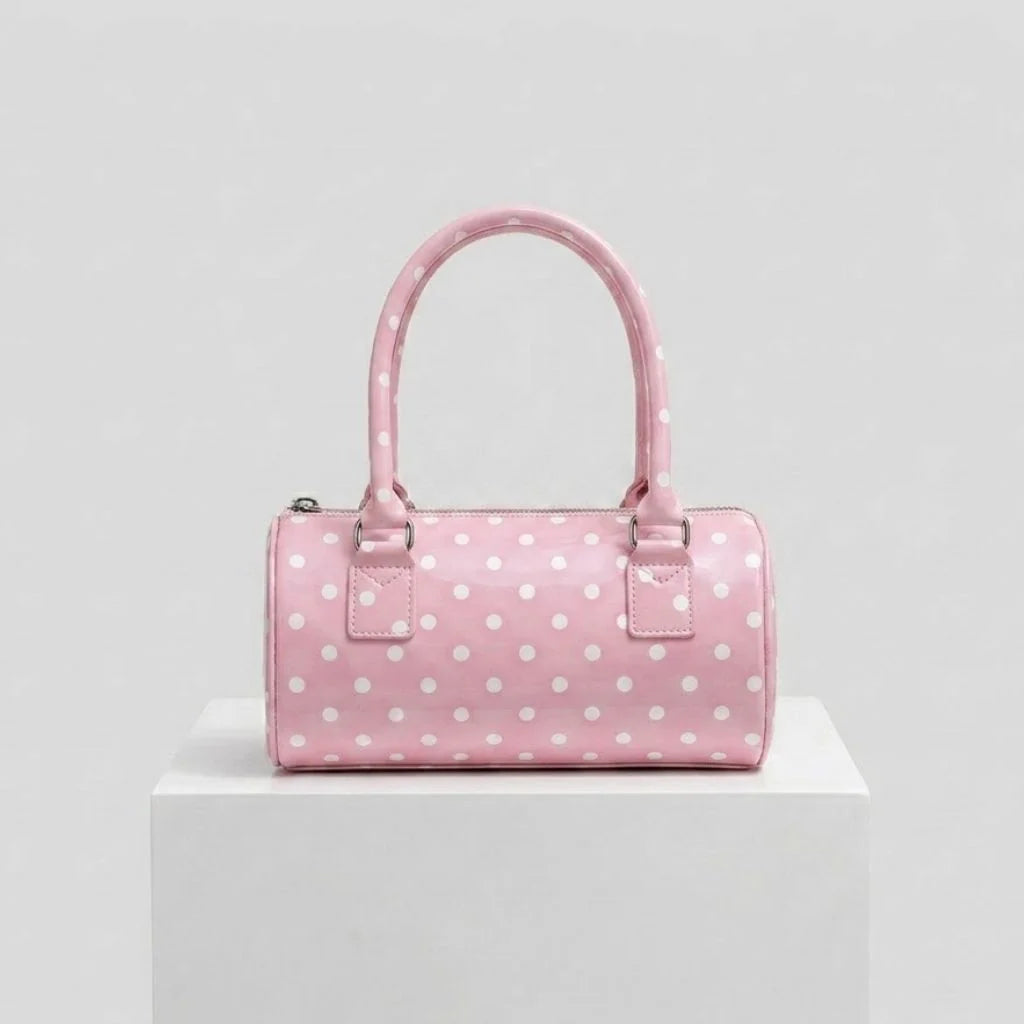 Bolso De Mano Compacto Con Patrón Distintivo Y Detalle Decorativo