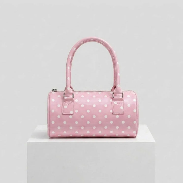 Bolso De Mano Compacto Con Patrón Distintivo Y Detalle Decorativo