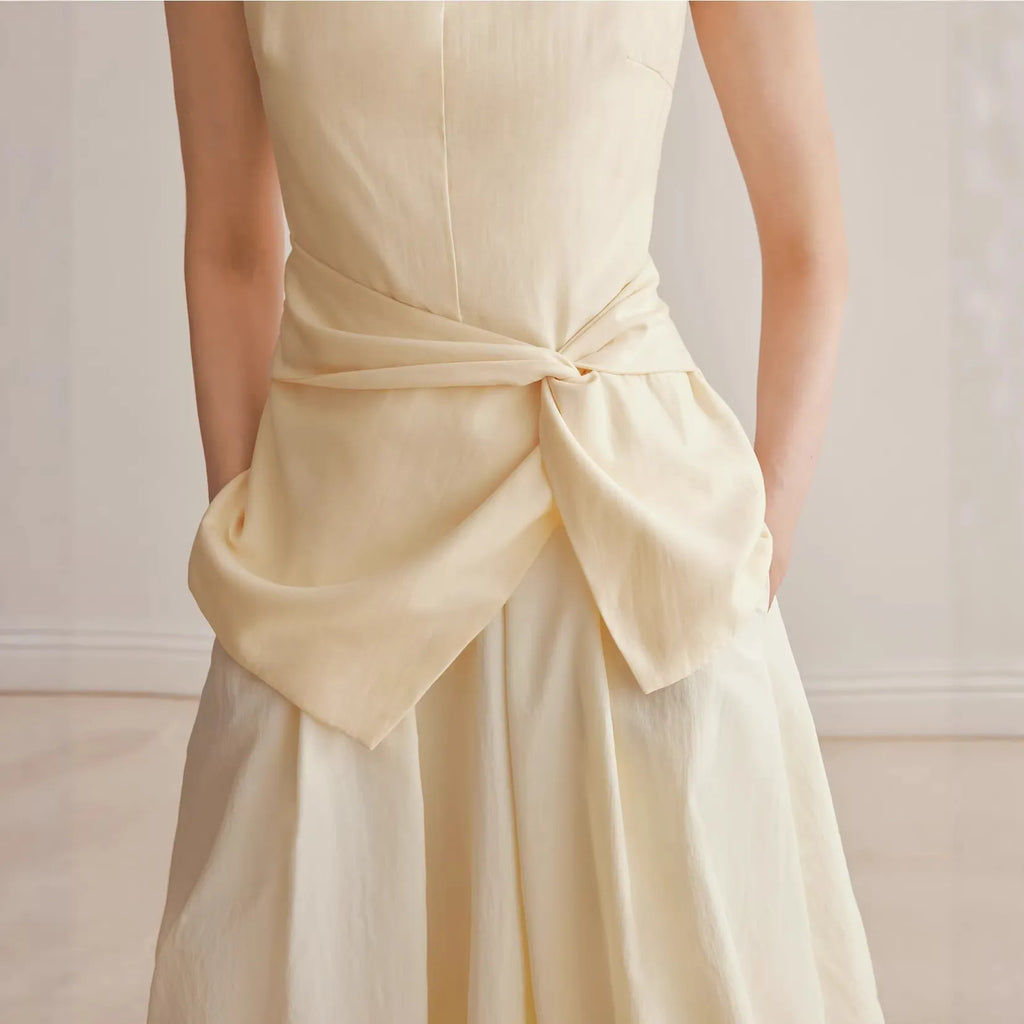 Conjunto top tirantes nudo y falda midi burbuja cintura alta minimalista