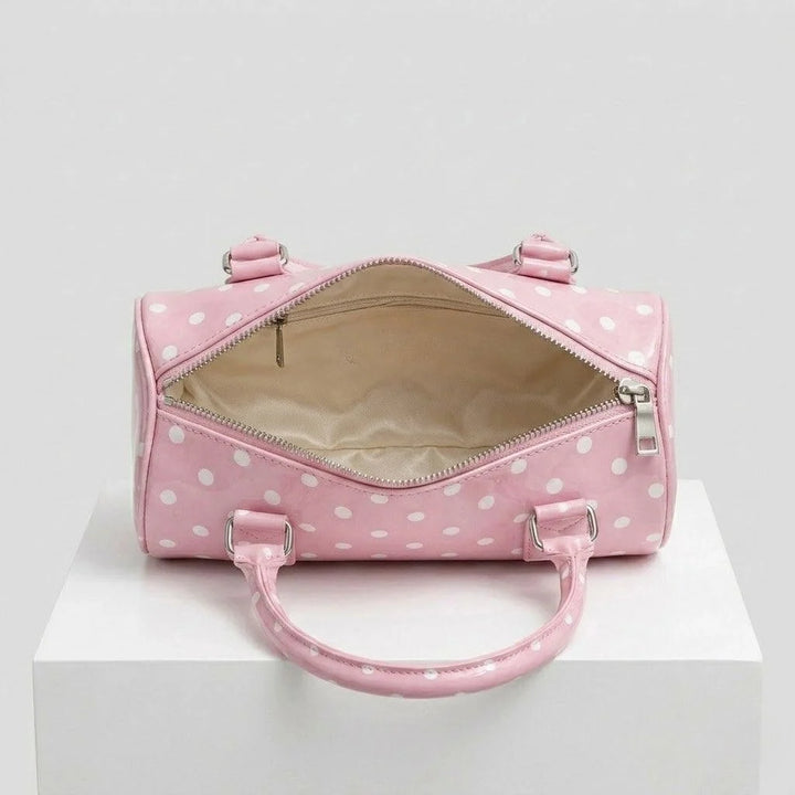 Bolso De Mano Compacto Con Patrón Distintivo Y Detalle Decorativo