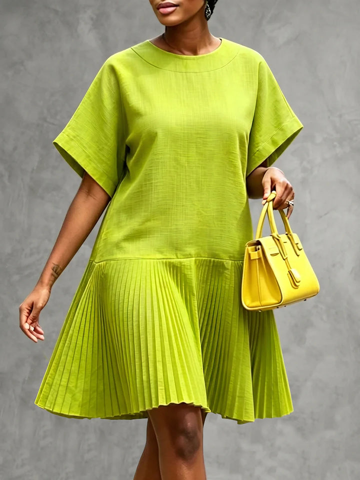 VESTIDO CURTO PLISSADO SOLTO EM ALGODÃO COM GOLA REDONDA E MANGA CURTA