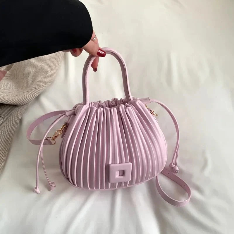 KÅRA | BOLSO DE MANO ELEGANTE CON PLIEGUES EN ROSA PALO