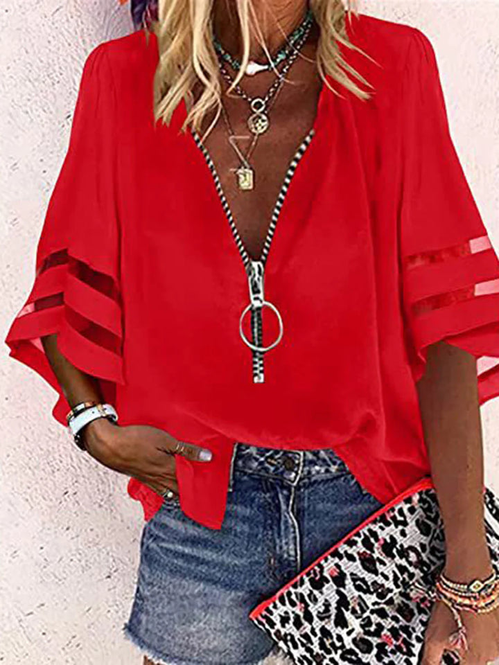 BLUSA FOLGADA DE MANGA TRÊS QUARTOS COM BAINHA, FECHO E GOLA MANDARIM