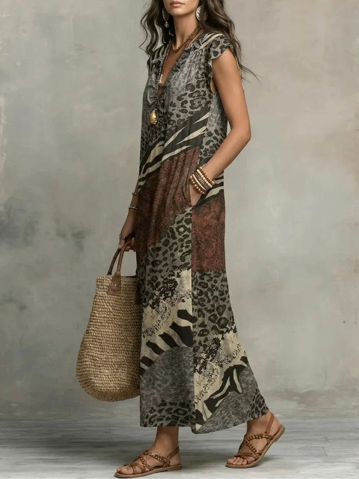 VESTIDO MAXI SOLTO SEM MANGAS COM BOLSOS, ESTAMPADO, FOLHOS E DECOTE EM V