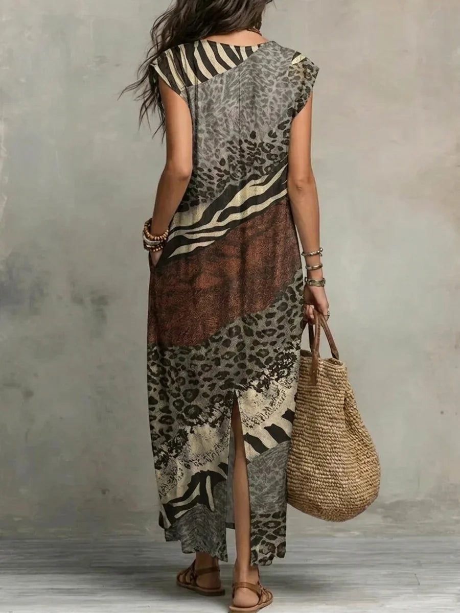 VESTIDO MAXI SOLTO SEM MANGAS COM BOLSOS, ESTAMPADO, FOLHOS E DECOTE EM V