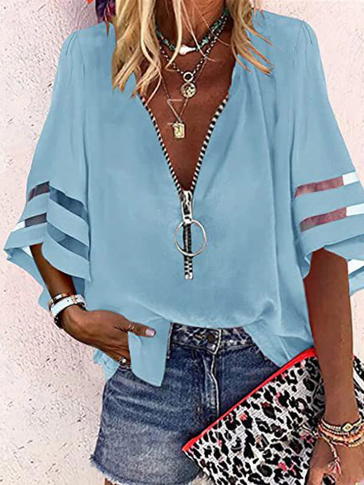 BLUSA FOLGADA DE MANGA TRÊS QUARTOS COM BAINHA, FECHO E GOLA MANDARIM