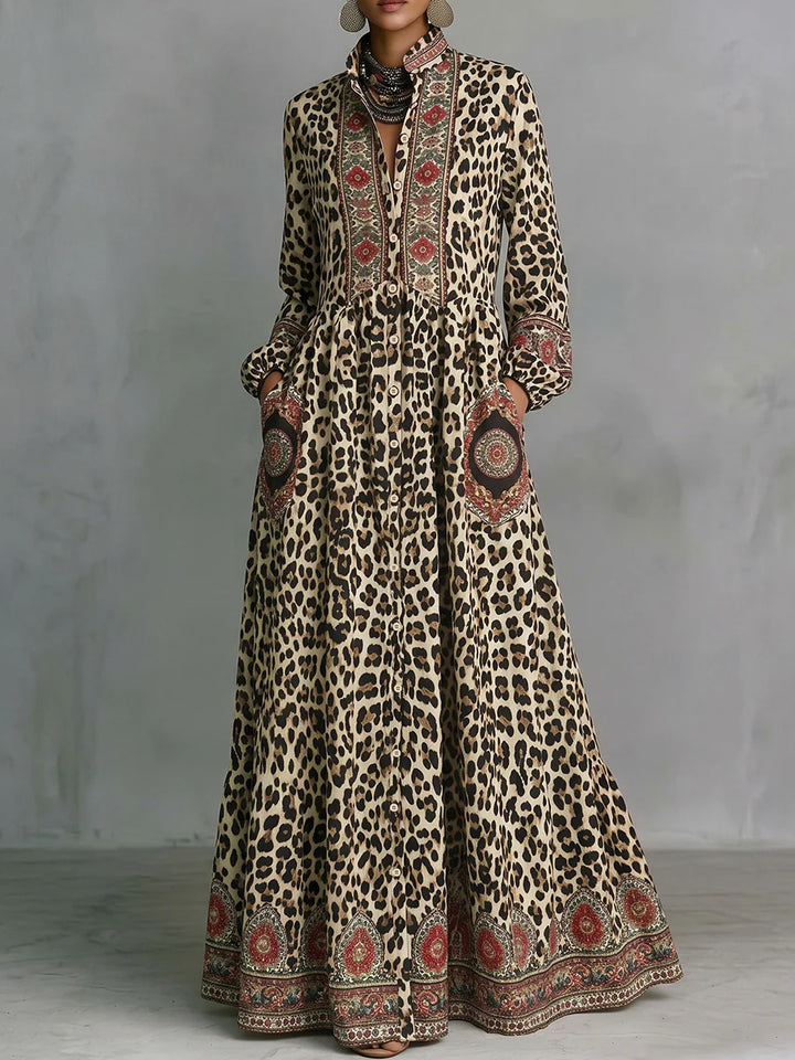 VESTIDO MAXI EM LINHA A ESTAMPADO LEOPARDO COM BOLSOS, MANGA ABALOADA E GOLA MAO