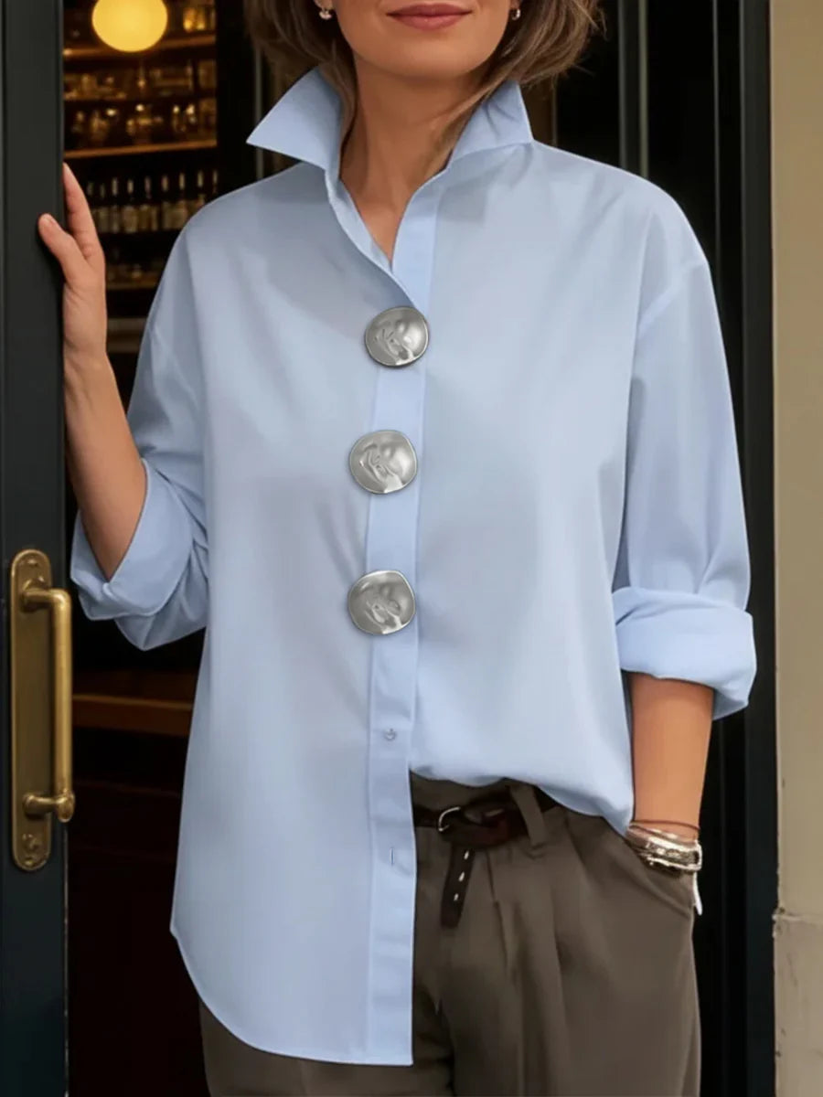 Blusa manga larga suelta solapa abotonada uniones divididas color sólido