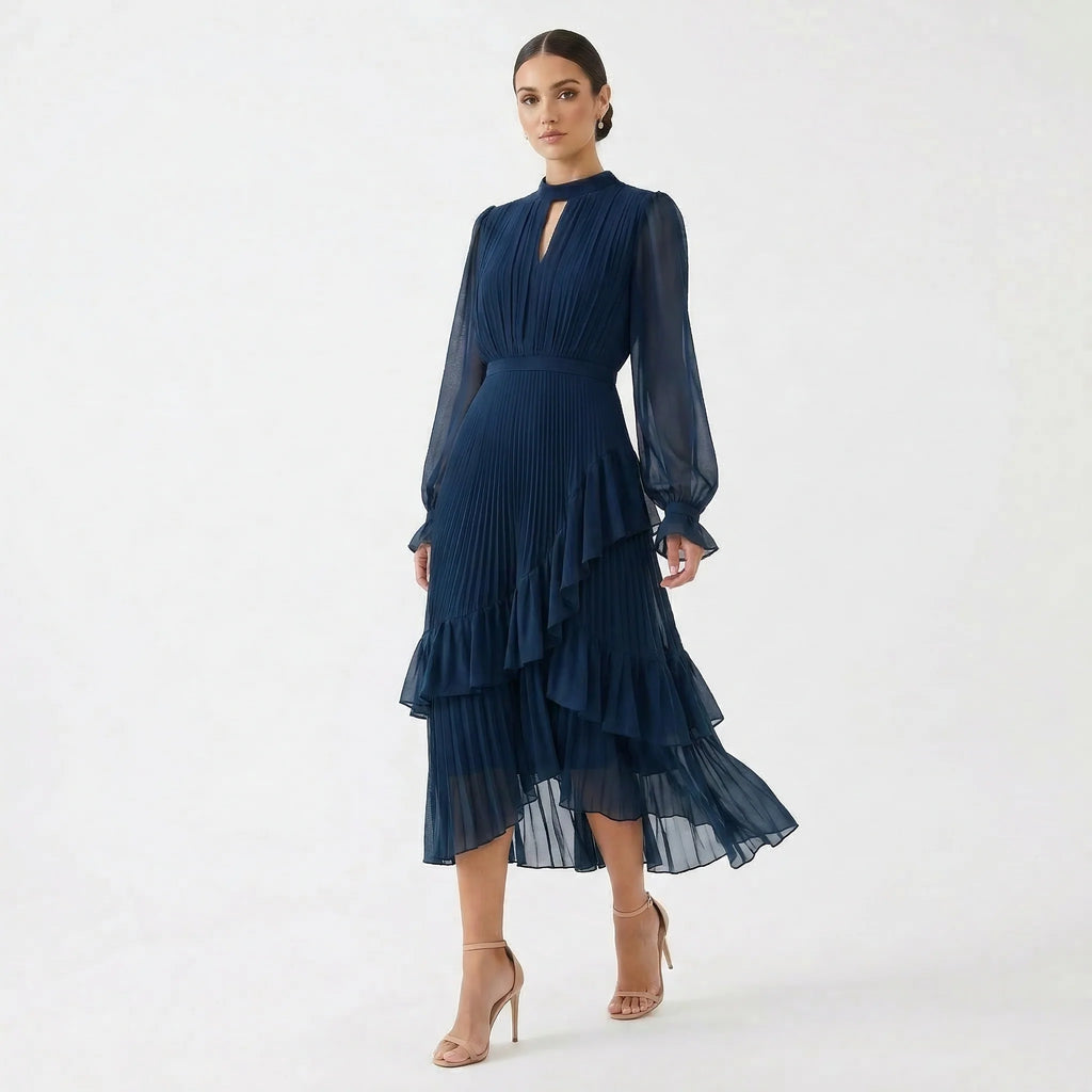 MARIANA - VESTIDO PLISADO CON MANGAS FLUIDAS y VOLANTES ASIMÉTRICOS