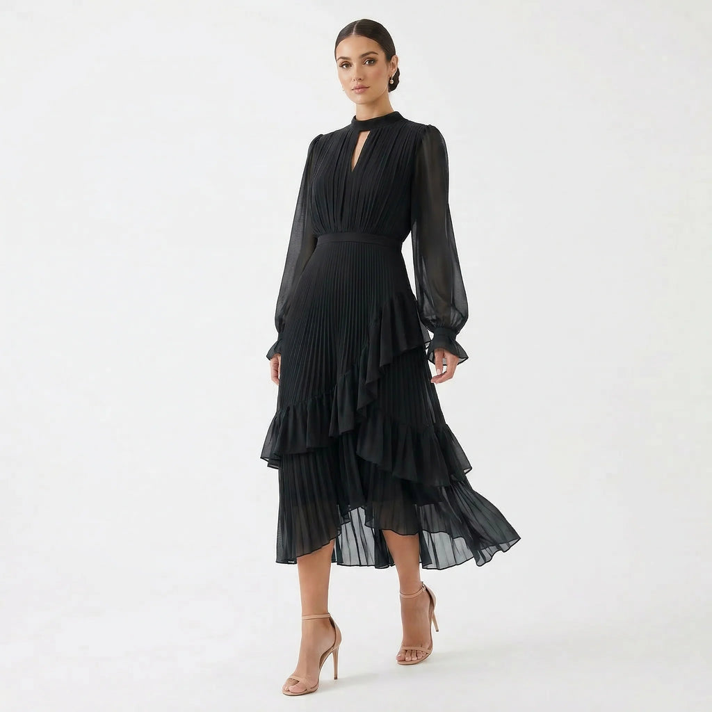 MARIANA - VESTIDO PLISADO CON MANGAS FLUIDAS y VOLANTES ASIMÉTRICOS