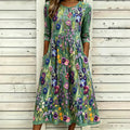 Vestido maxi de lino con bordado floral violeta elegante