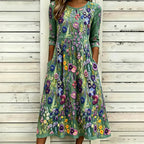 Vestido maxi de lino con bordado floral violeta elegante