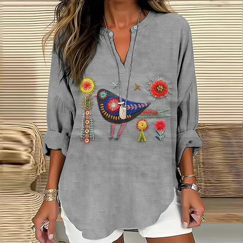 - CAMISA CUELLO V BORDADO FLORAL Y PÁJAROS