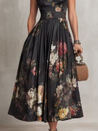 Violeta - Vestido midi negro de satén plisado con estampado floral y escote en V