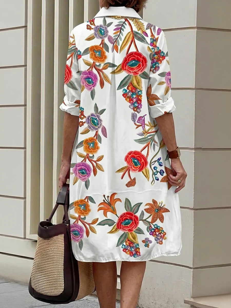 VESTIDO MIDI CAMISEIRO EM CORTE EM A DE MANGA MÉDIA COM BOTÕES, ESTAMPADO FLORAL EM CONTRASTE E BOLSOS