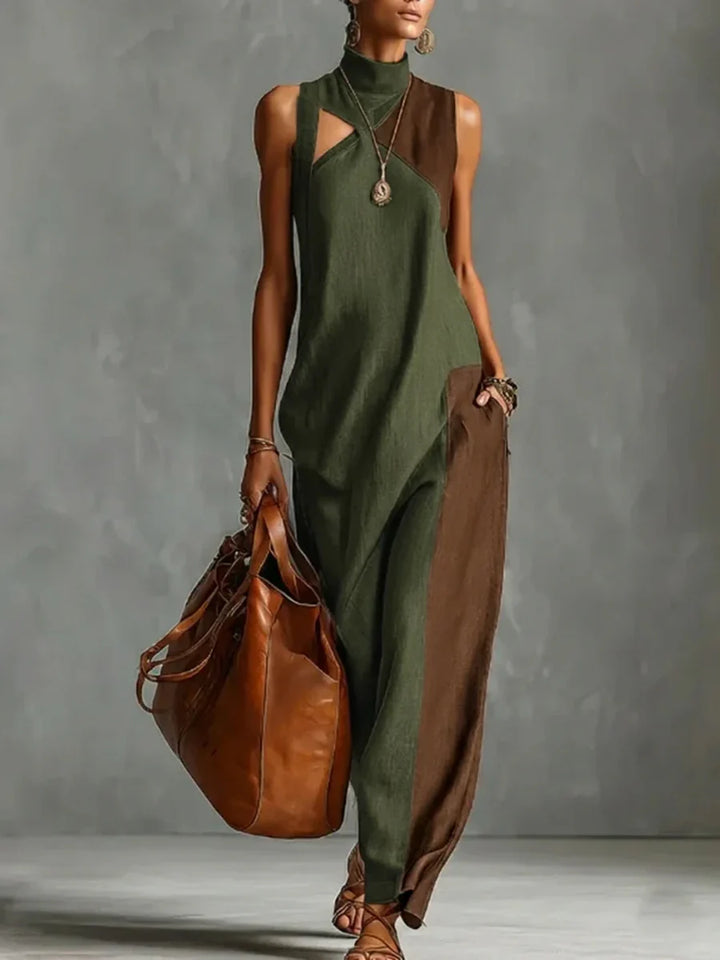 VESTIDO MAXI ASSIMÉTRICO SEM MANGAS FOLGADO COM BOLSOS, COR EM CONTRASTE E GOLA ALTA