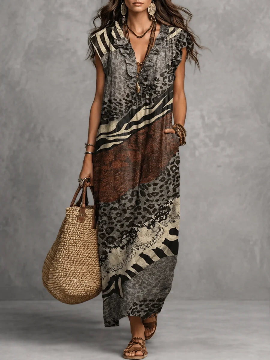 VESTIDO MAXI SOLTO SEM MANGAS COM BOLSOS, ESTAMPADO, FOLHOS E DECOTE EM V
