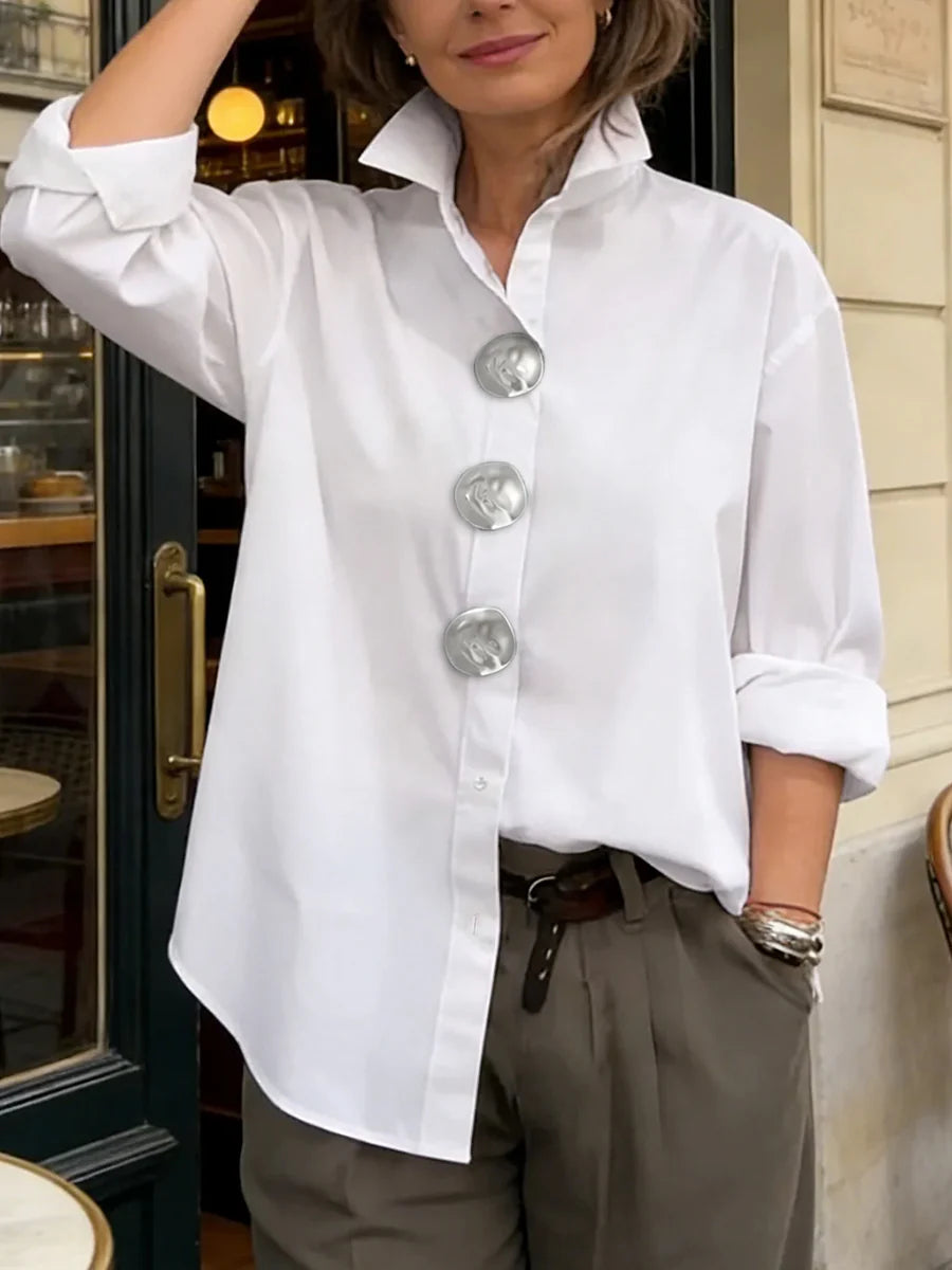 Blusa manga larga suelta solapa abotonada uniones divididas color sólido