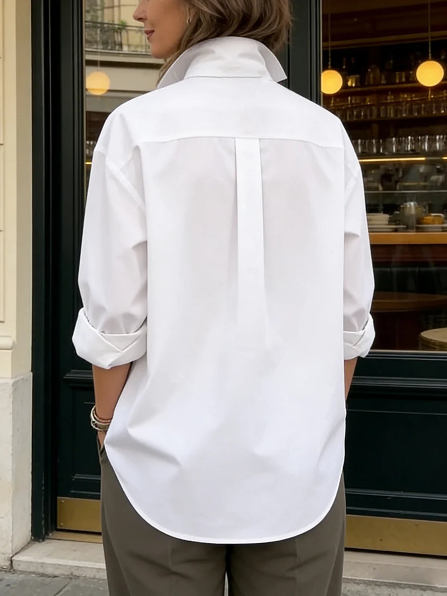 Blusa manga larga suelta solapa abotonada uniones divididas color sólido