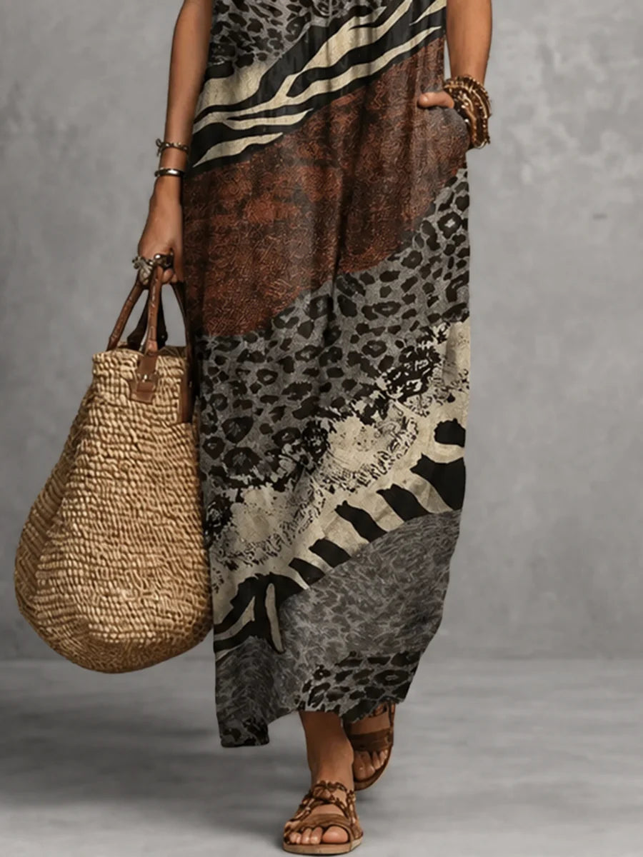 VESTIDO MAXI SOLTO SEM MANGAS COM BOLSOS, ESTAMPADO, FOLHOS E DECOTE EM V