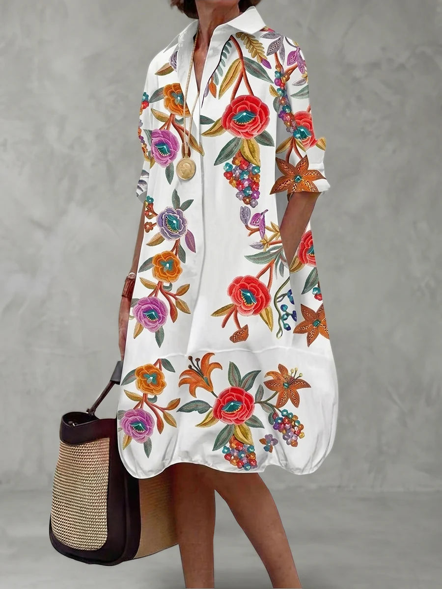 VESTIDO MIDI CAMISEIRO EM CORTE EM A DE MANGA MÉDIA COM BOTÕES, ESTAMPADO FLORAL EM CONTRASTE E BOLSOS