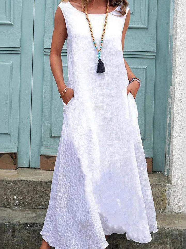 VESTIDO MAXI SOLTO COM BOLSOS E LISO - DECOTE CAI-CAI - TAMANHOS GRANDES