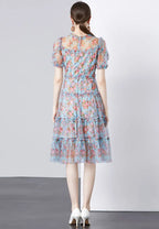 Vestido midi tul floral azul con mangas abullonadas y volantes k26062802