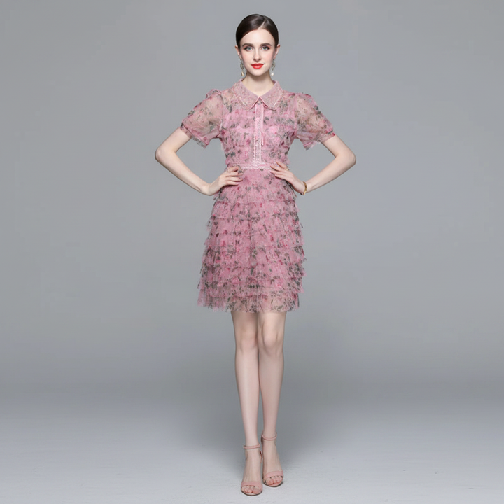 VESTIDO MINI TUL FLORAL ROSA CON CUELLO PETER PAN Y VOLANTES K26061502