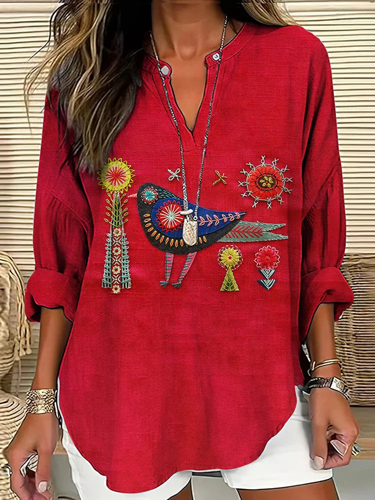 - CAMISA CUELLO V BORDADO FLORAL Y PÁJAROS